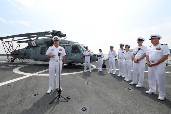 This photo, provided by Kookbangilbo, shows Captain Louis Catalina, commanding officer of the USS Blue Ridge, responding to reporters