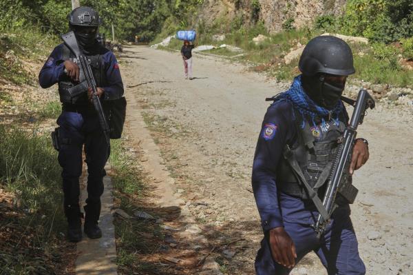 Police officers patrol in Port-au-Prince, Haiti, in August. (AP-Yonhap)